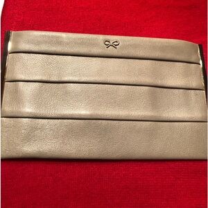 Gorgeous Anya Hindmarch taupe leather pleated zippered clutch with tassel detail